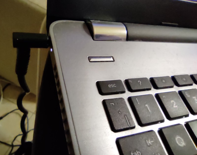 laptop connected to power charger